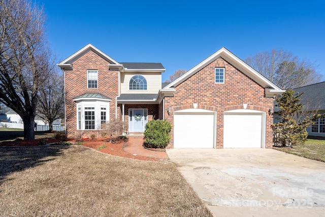 front of property featuring a front yard and a garage