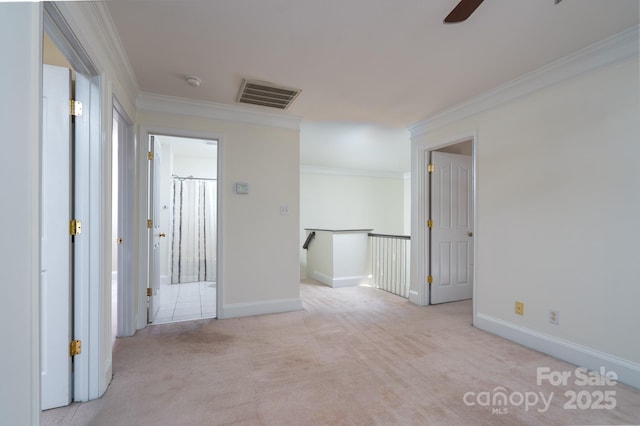 carpeted empty room with crown molding and ceiling fan