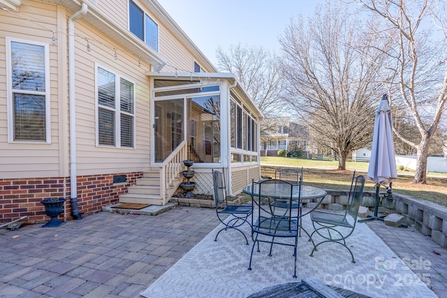 view of patio with a sunroom