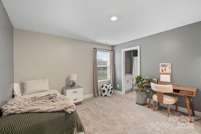 bedroom featuring light carpet