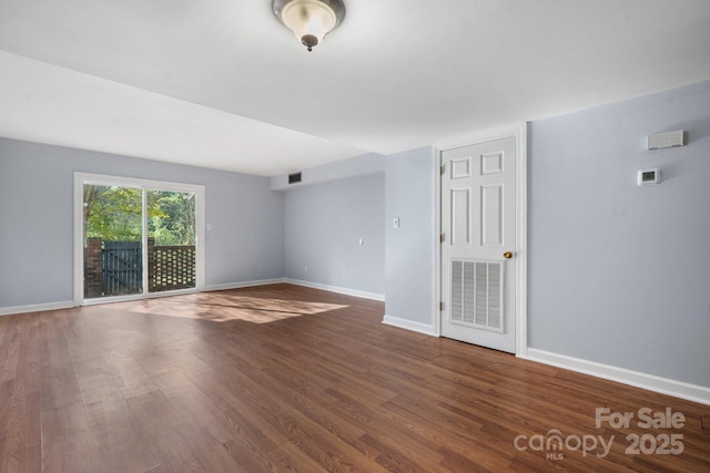 empty room featuring dark wood-type flooring