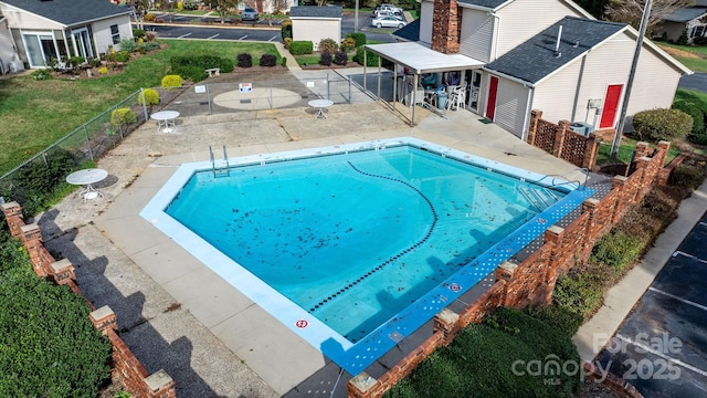 view of pool featuring a patio