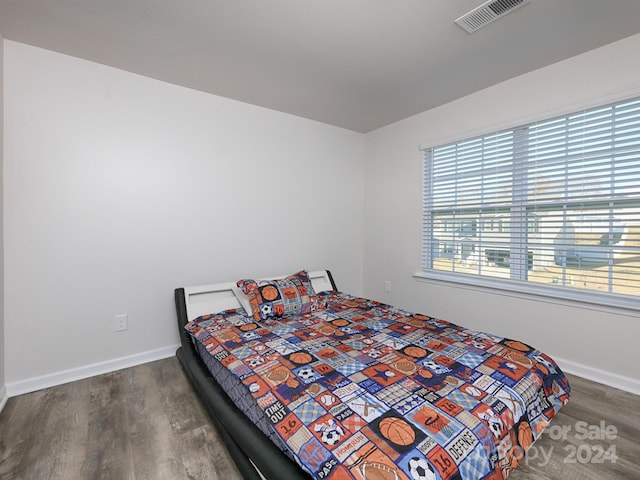 bedroom featuring dark hardwood / wood-style floors