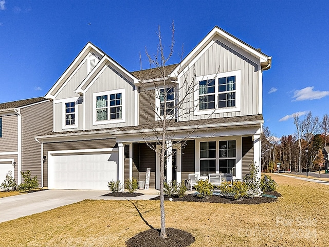 view of front of house with a porch and a garage