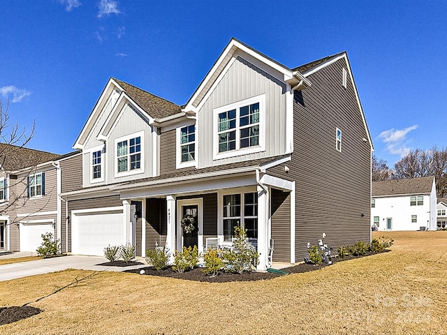 view of front of house featuring covered porch and a garage