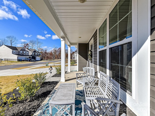 view of patio featuring a porch