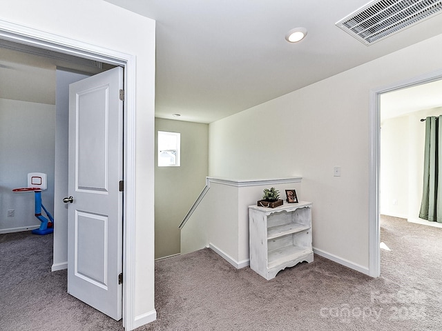 hallway with light carpet