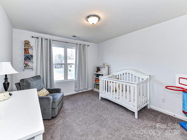 carpeted bedroom with a crib