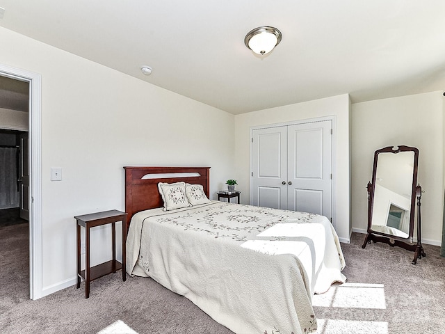 carpeted bedroom featuring a closet