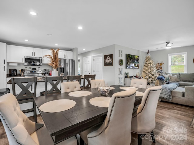 dining room with dark hardwood / wood-style floors and ceiling fan