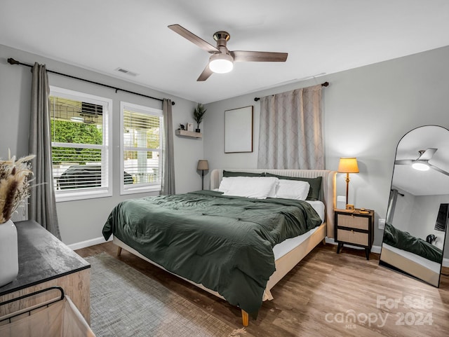 bedroom featuring hardwood / wood-style floors and ceiling fan