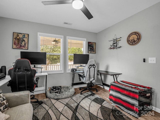 office space with hardwood / wood-style flooring and ceiling fan