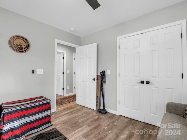 sitting room with hardwood / wood-style flooring