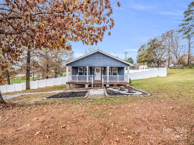 view of front of property with a front yard and a porch