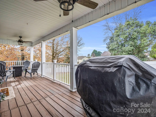 deck with ceiling fan and a grill