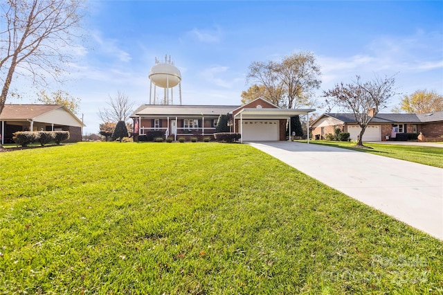 view of front of home featuring a garage and a front yard