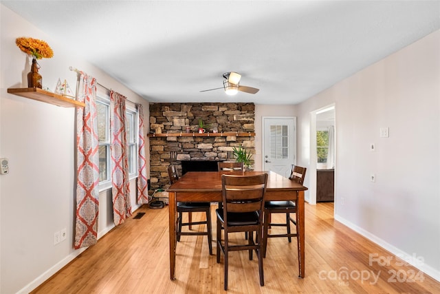 dining area featuring ceiling fan and light wood-type flooring