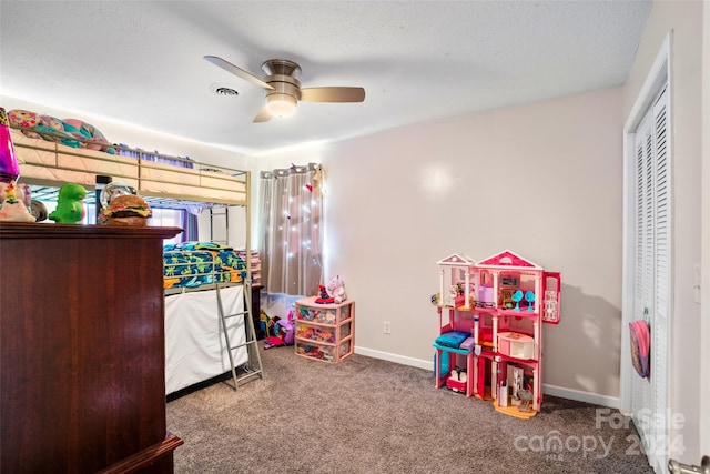 bedroom featuring ceiling fan, a closet, and carpet floors