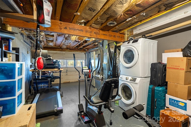 laundry room with stacked washer / dryer