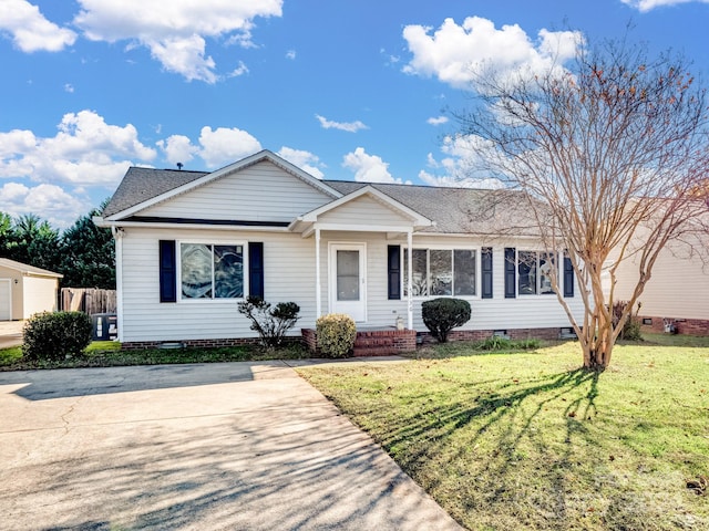 ranch-style home with a front lawn