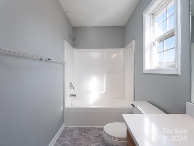 full bathroom with vanity, bathtub / shower combination, and toilet