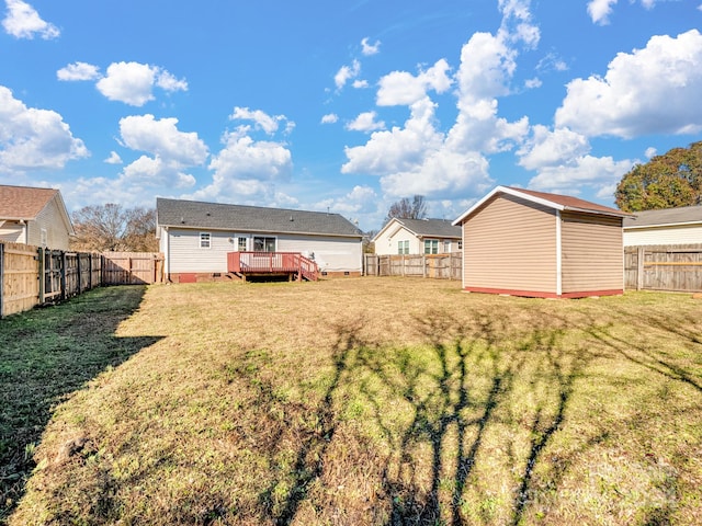 view of yard featuring a wooden deck