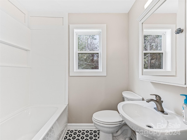 bathroom with tile patterned floors, toilet, and sink