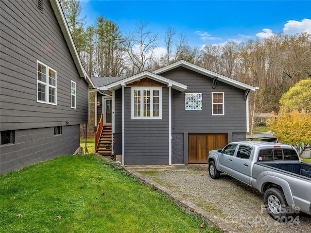 view of side of home featuring a yard