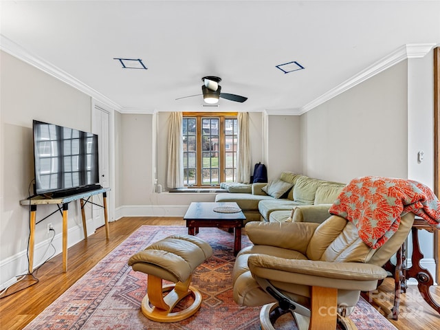 living room with hardwood / wood-style floors, ceiling fan, and ornamental molding