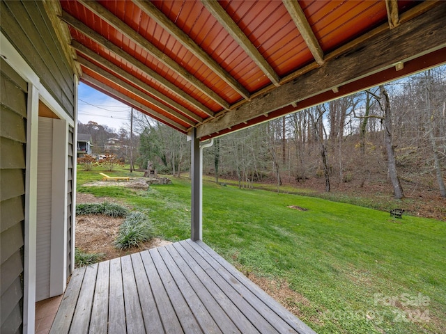 wooden terrace with a yard