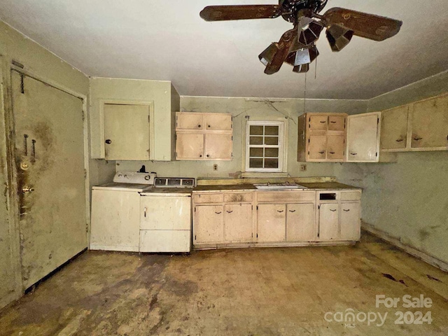 kitchen featuring cream cabinets, concrete floors, independent washer and dryer, and sink