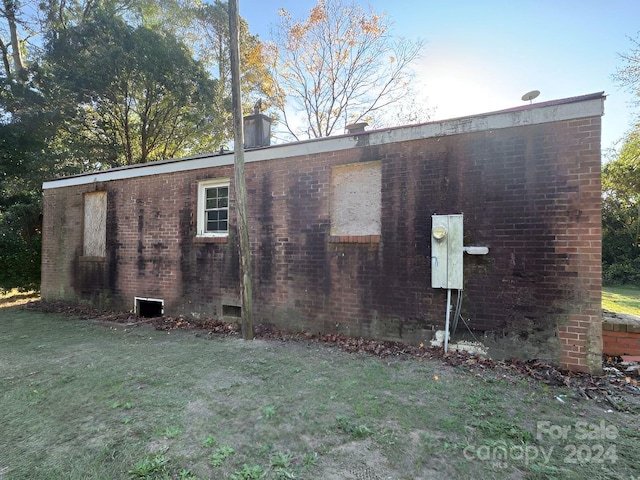 view of property exterior featuring a yard