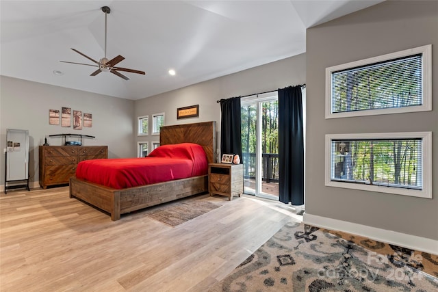 bedroom with ceiling fan, light hardwood / wood-style floors, access to exterior, and multiple windows