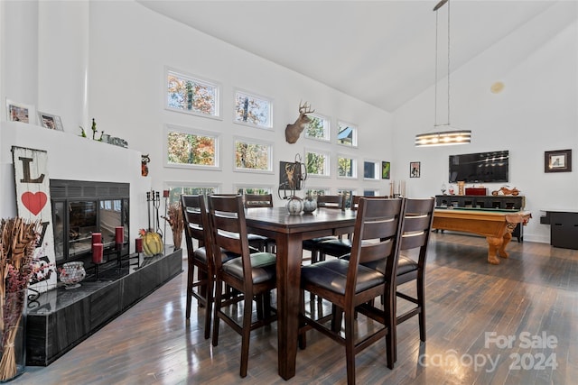 dining area featuring a fireplace, high vaulted ceiling, dark wood-type flooring, and billiards