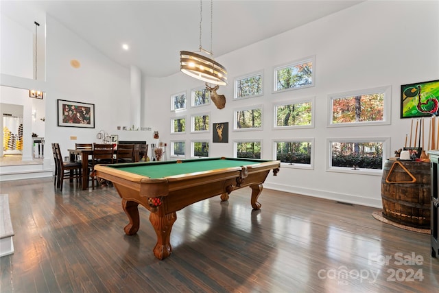 recreation room featuring pool table, a fireplace, dark wood-type flooring, and high vaulted ceiling