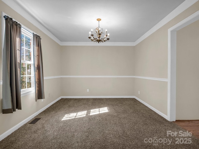 unfurnished room featuring baseboards, ornamental molding, visible vents, and an inviting chandelier