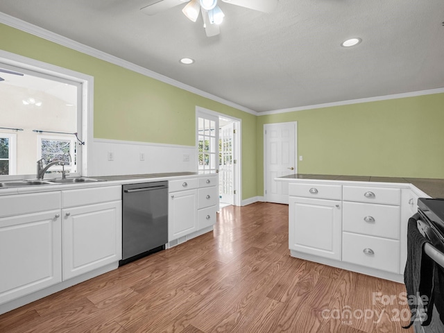 kitchen featuring a sink, white cabinetry, and stainless steel dishwasher