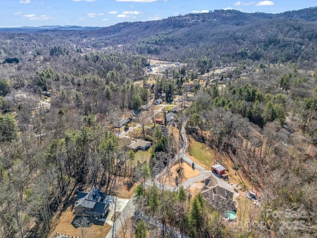 aerial view with a mountain view and a forest view