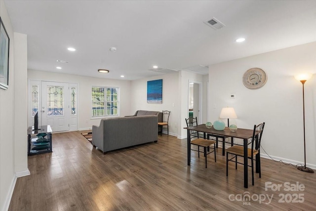 dining area with dark hardwood / wood-style flooring