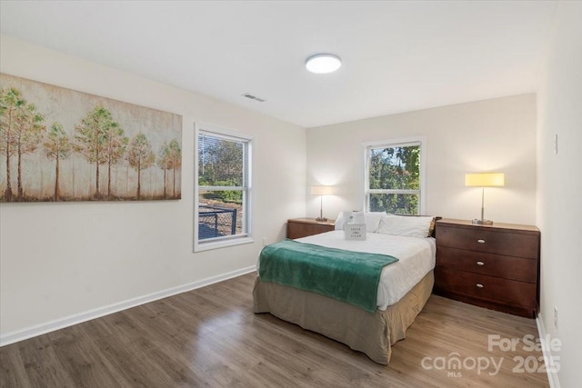 bedroom featuring wood-type flooring