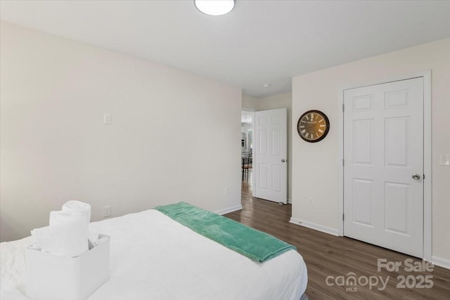 bedroom featuring dark wood-type flooring