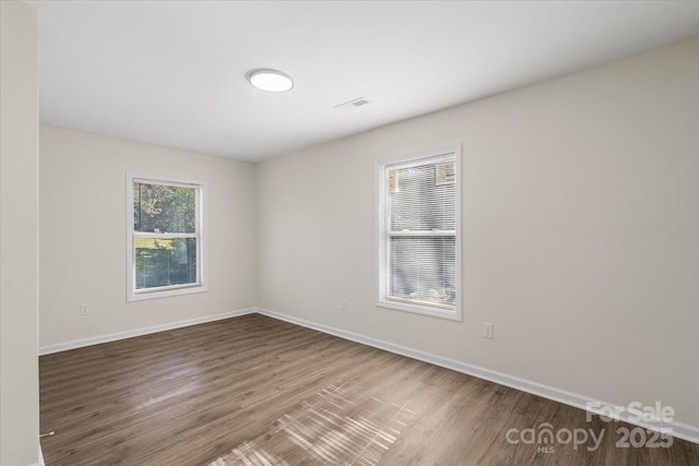 empty room with wood-type flooring