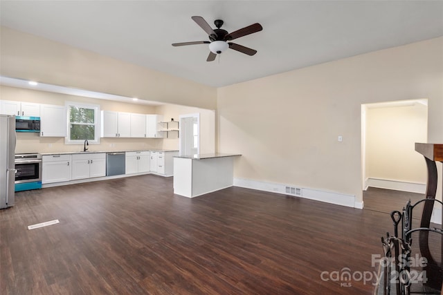 kitchen featuring white cabinets, dark hardwood / wood-style floors, and appliances with stainless steel finishes