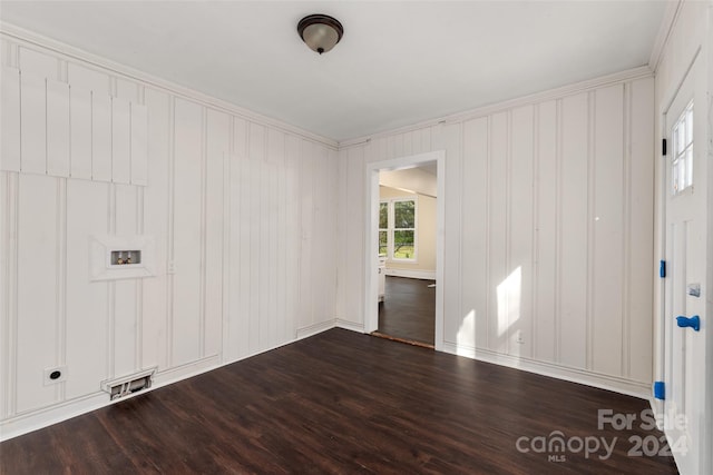 unfurnished room with hardwood / wood-style floors, plenty of natural light, and crown molding