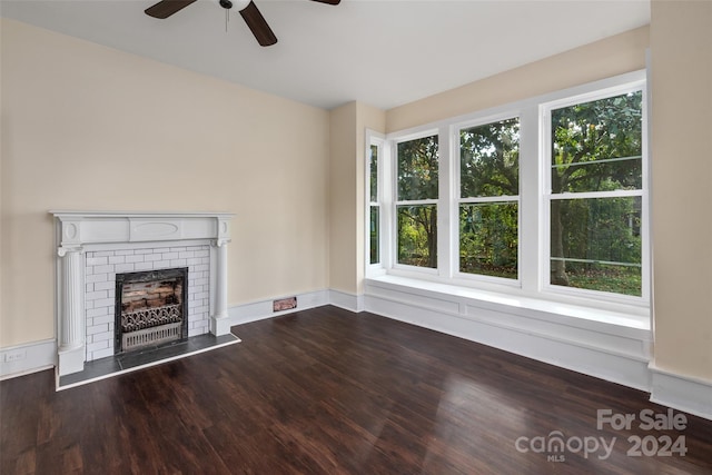 unfurnished living room with hardwood / wood-style floors and a wealth of natural light