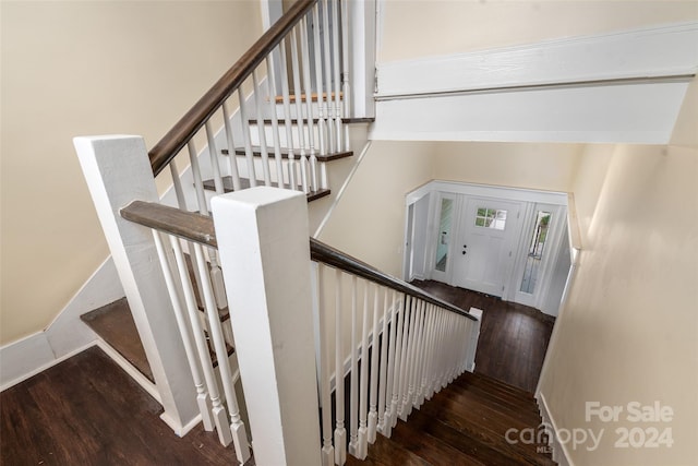 staircase featuring hardwood / wood-style flooring