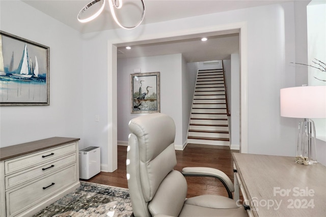 office space featuring dark hardwood / wood-style floors and a notable chandelier