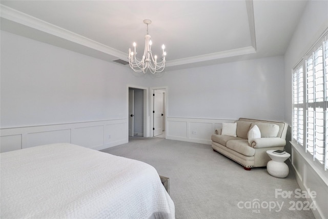 bedroom with a raised ceiling, ornamental molding, light carpet, and a chandelier