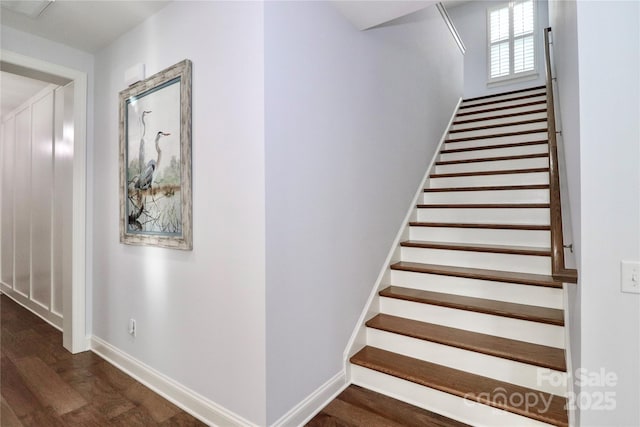 stairway with hardwood / wood-style floors