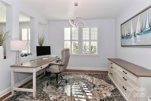 office with dark hardwood / wood-style floors